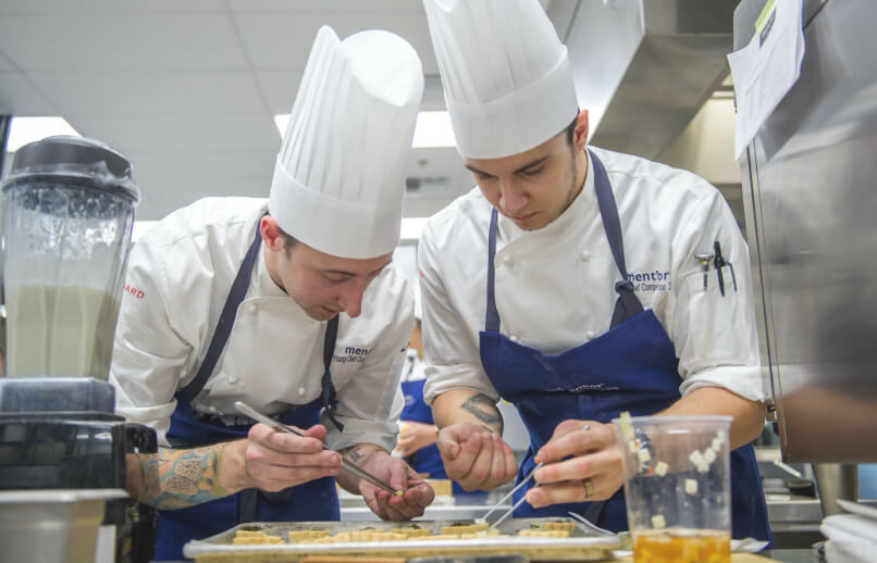 Student chefs preparing meal